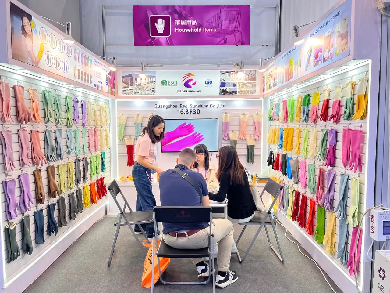 Red Sunshine team and a wide selection of rubber glove styles at an industry exhibition
