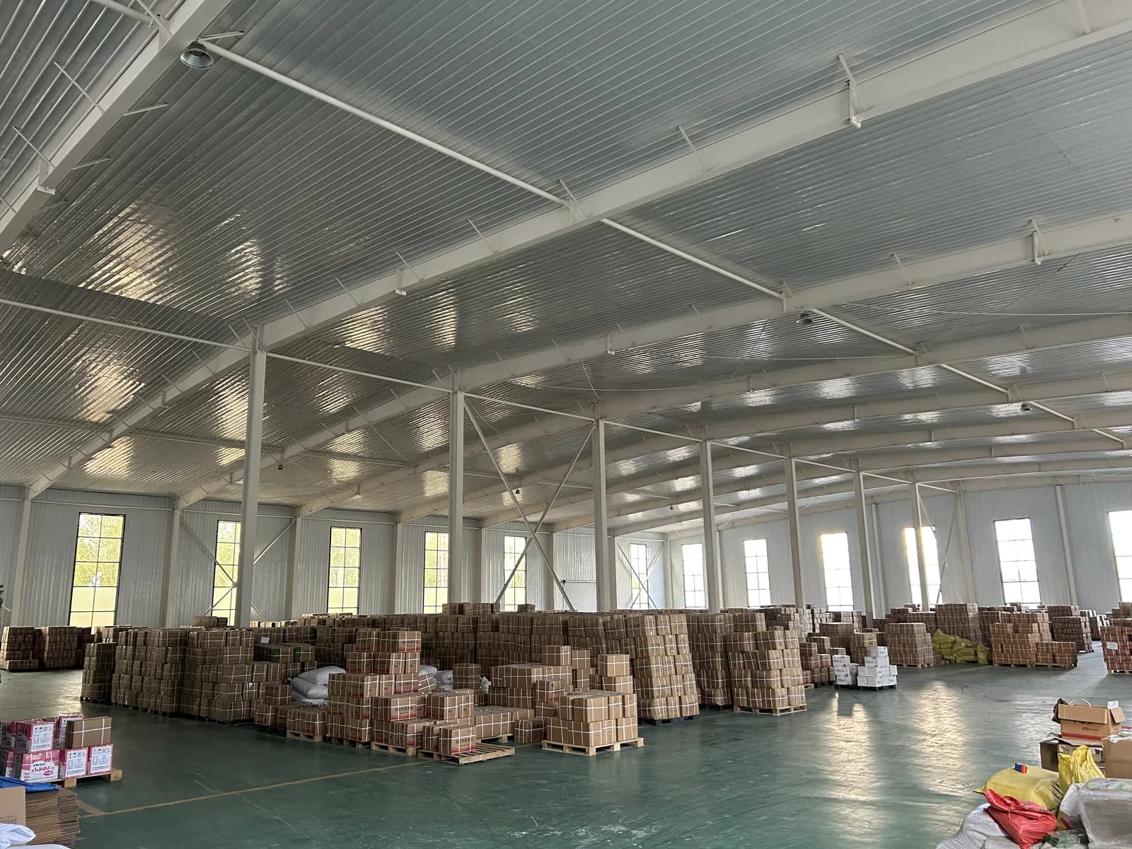 Finished goods warehouse with pallets of packed glove cartons