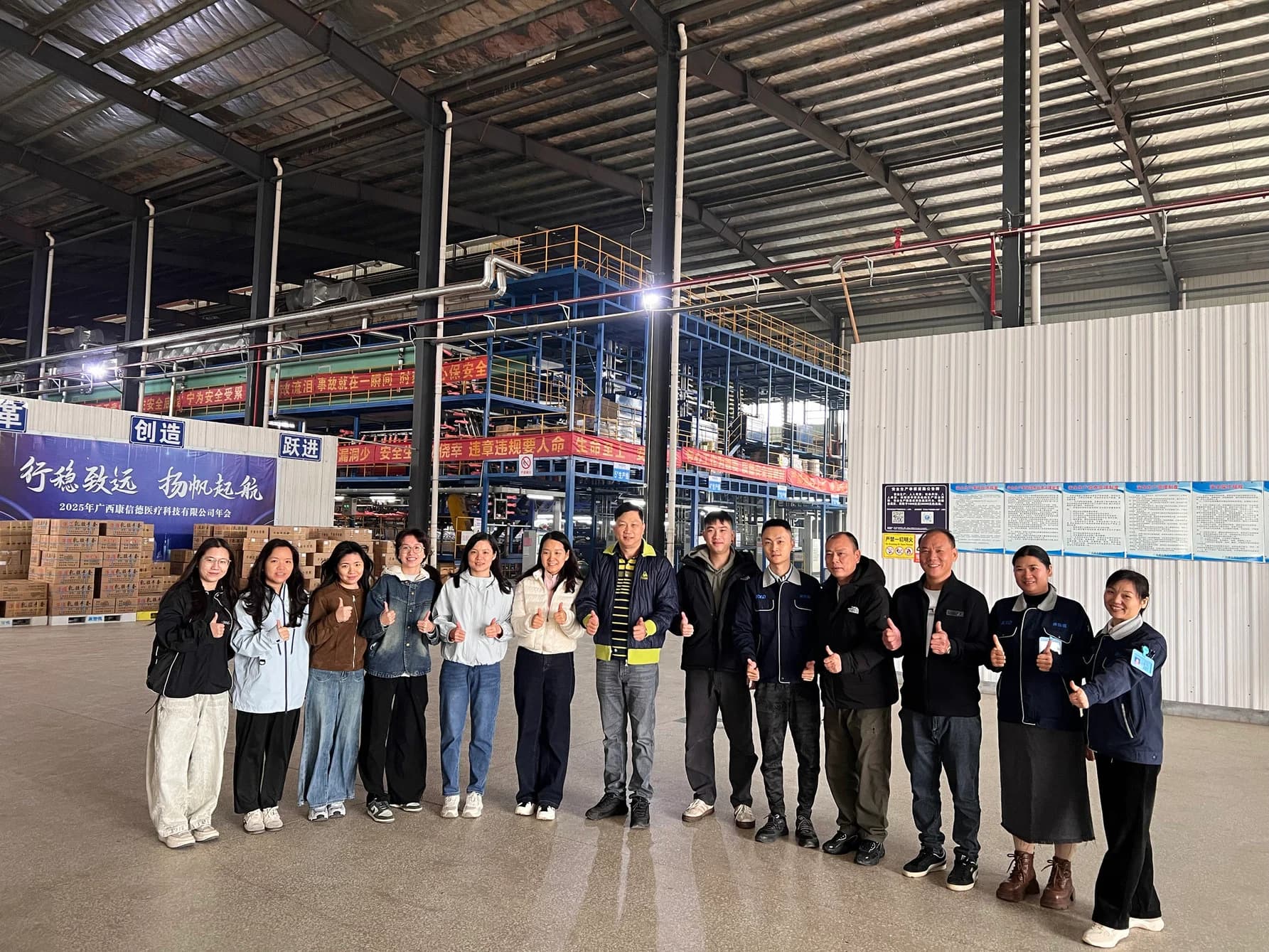 Red Sunshine team standing together in the factory